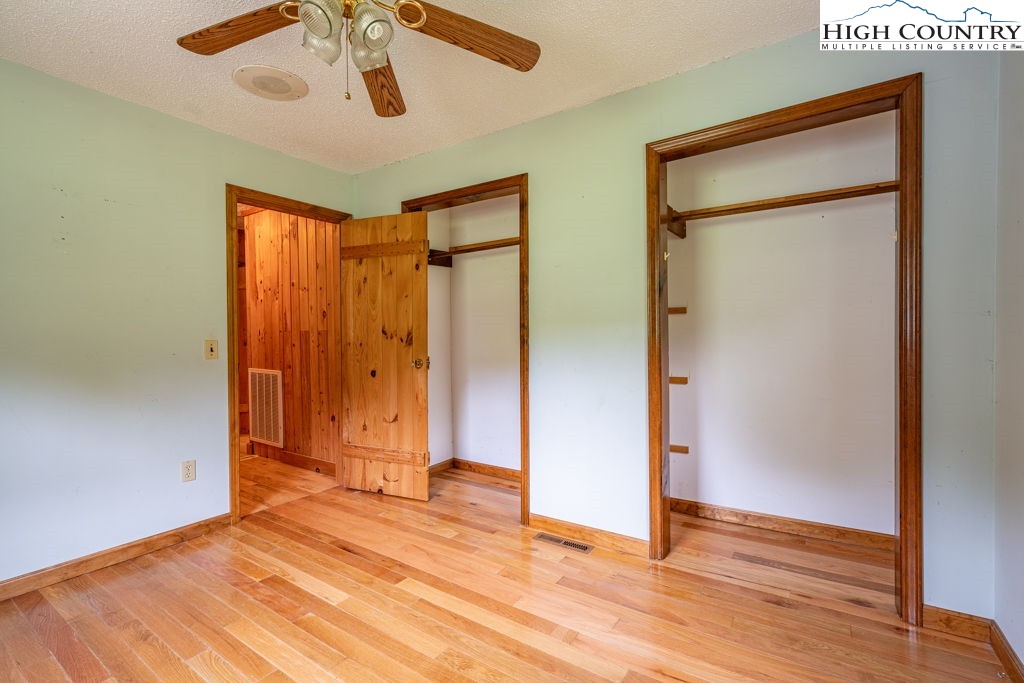 175 Roaring Fork Road Todd, NC 28684 - Photo 11 of 24 a view of empty room with wooden floor