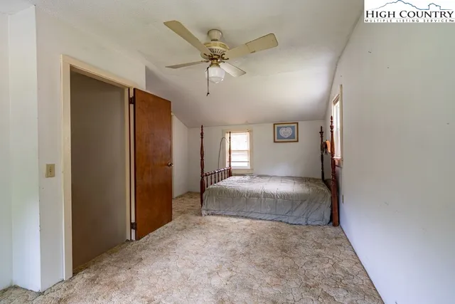 a view of a city with lush green forest