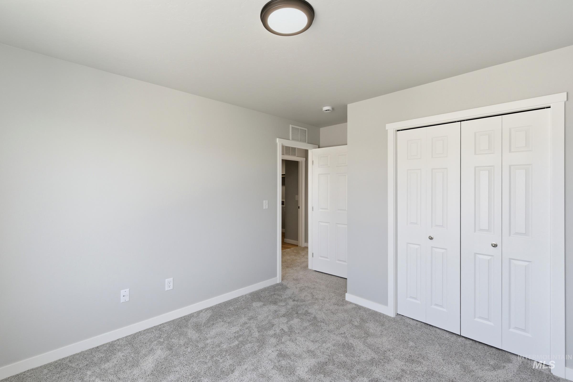 2374 West Fallon Loop Nampa, ID 83651 - Photo 15 of 24 Neutral-toned walls complement plush grey carpeting