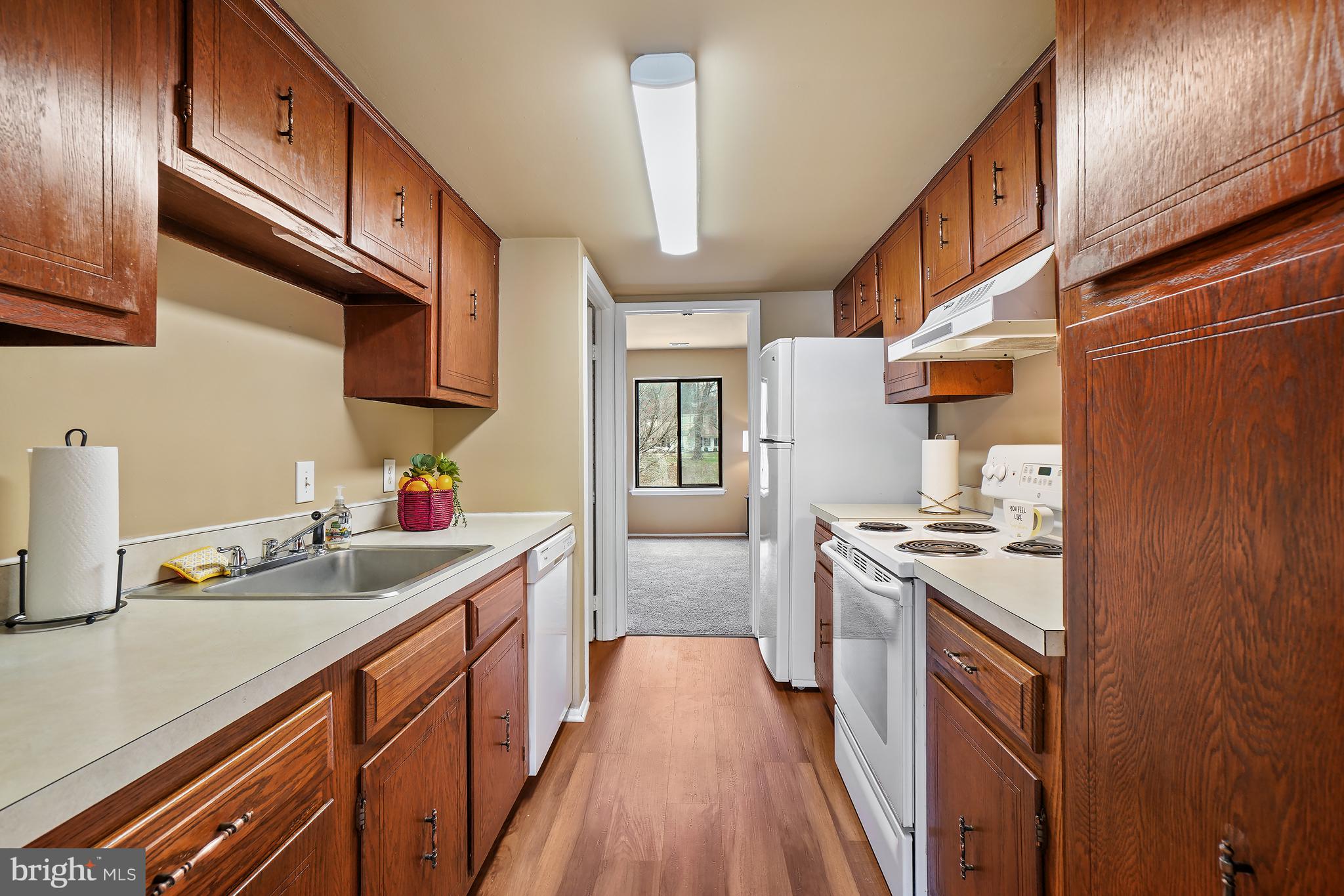 3136 Adderley Court, Unit 243G Silver Spring, MD 20906 - Photo 12 of 41 Laminate Kitchen Floors