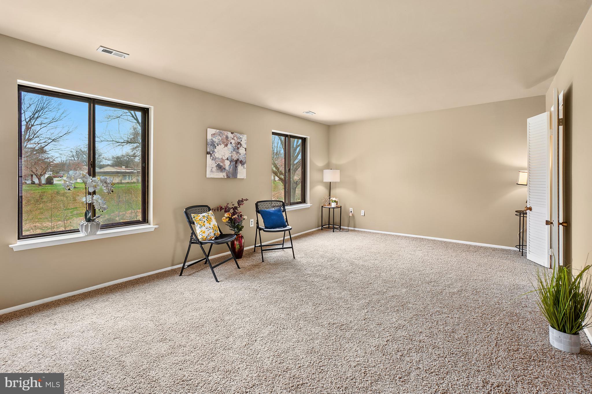 3136 Adderley Court, Unit 243G Silver Spring, MD 20906 - Photo 3 of 41 Living room with view of serene green space