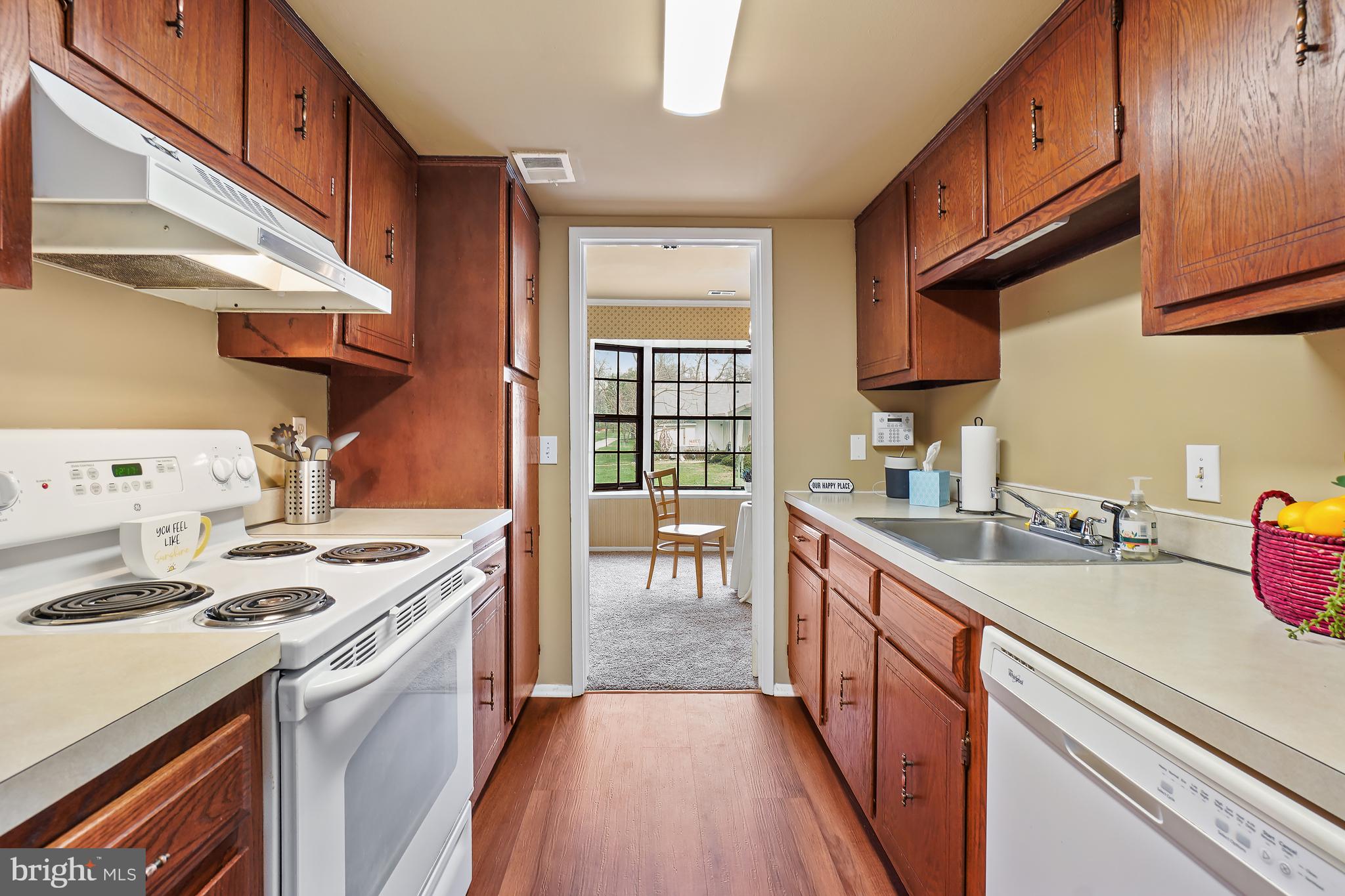 3136 Adderley Court, Unit 243G Silver Spring, MD 20906 - Photo 5 of 41 Kitchen spans between living and dining areas