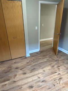 1529 South State Street, Unit 4B Chicago, IL 60605 - Photo 10 of 16 an empty room with wooden floor