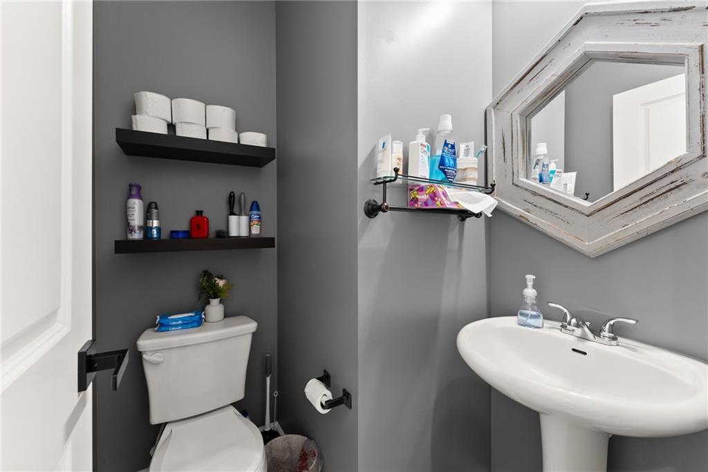 4302 Box Elder Path Gainesville, GA 30504 - Photo 17 of 53 a bathroom with a sink a mirror and toilet