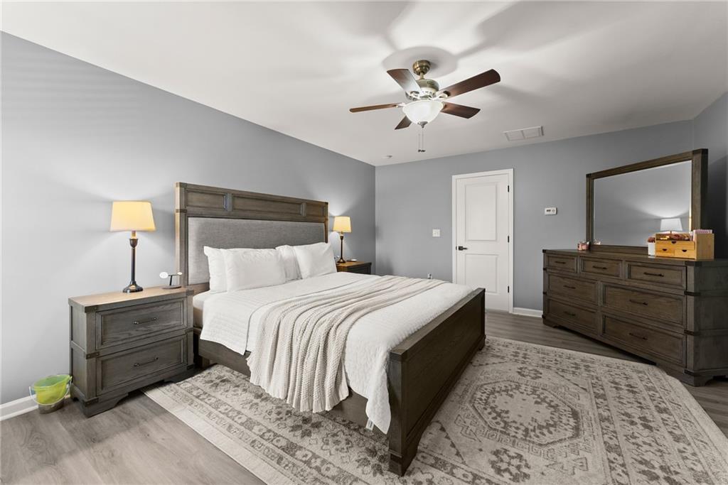 4302 Box Elder Path Gainesville, GA 30504 - Photo 20 of 53 a bedroom with a bed and a dresser