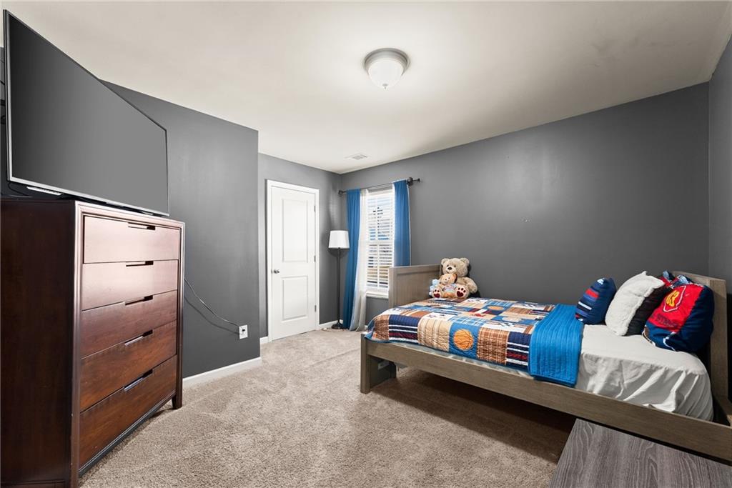 4302 Box Elder Path Gainesville, GA 30504 - Photo 25 of 53 a bedroom with bed and a furniture