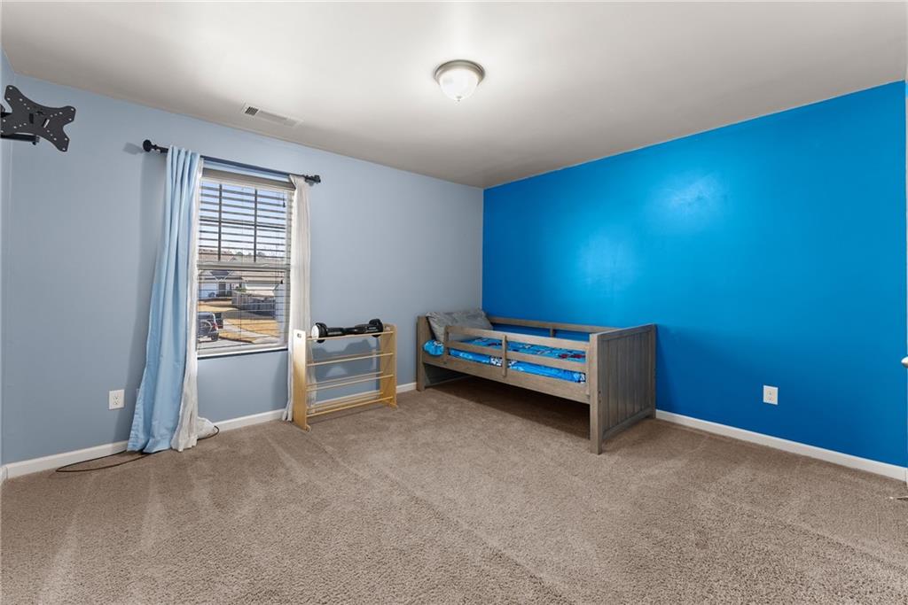 4302 Box Elder Path Gainesville, GA 30504 - Photo 27 of 53 a view of an empty room with a window