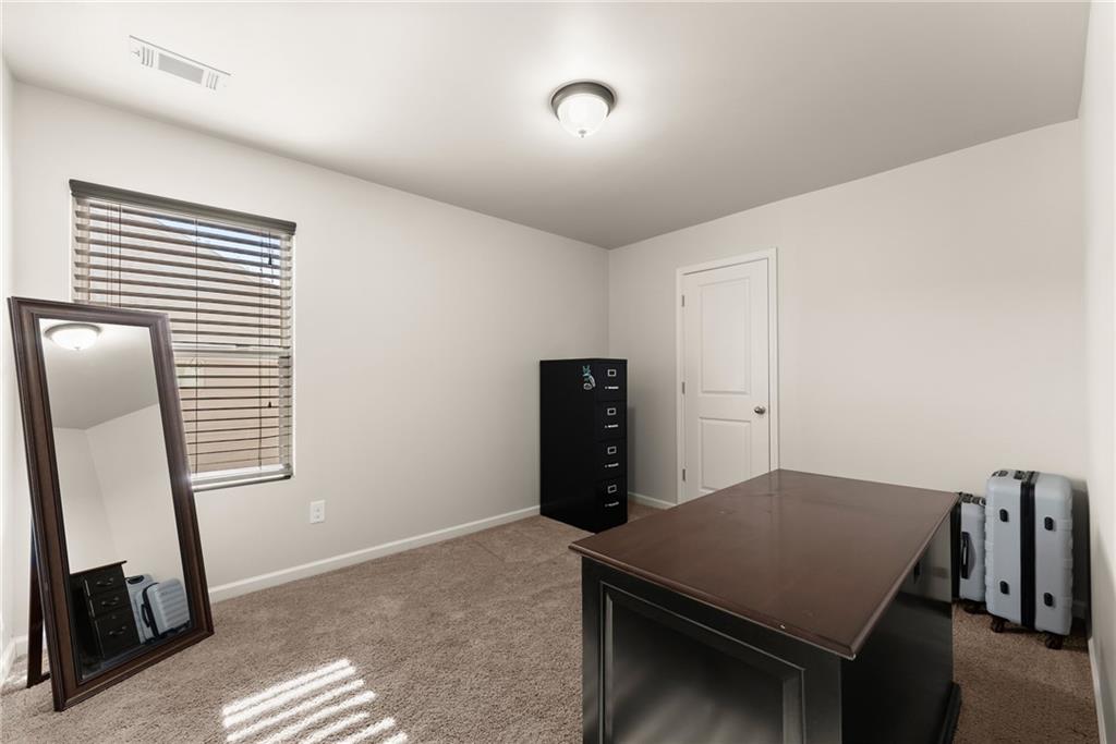 4302 Box Elder Path Gainesville, GA 30504 - Photo 29 of 53 a room with furniture and a window