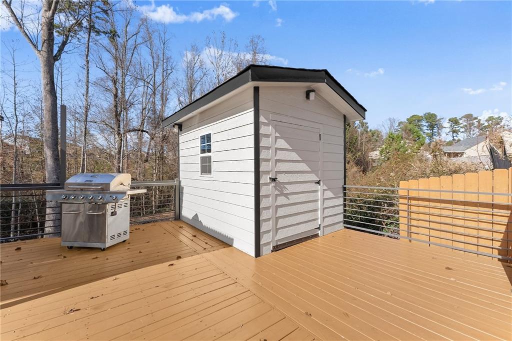 4302 Box Elder Path Gainesville, GA 30504 - Photo 40 of 53 a view of a wooden house with a yard