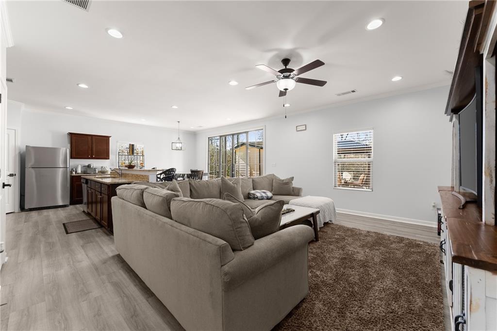 4302 Box Elder Path Gainesville, GA 30504 - Photo 7 of 53 a living room with furniture and a flat screen tv
