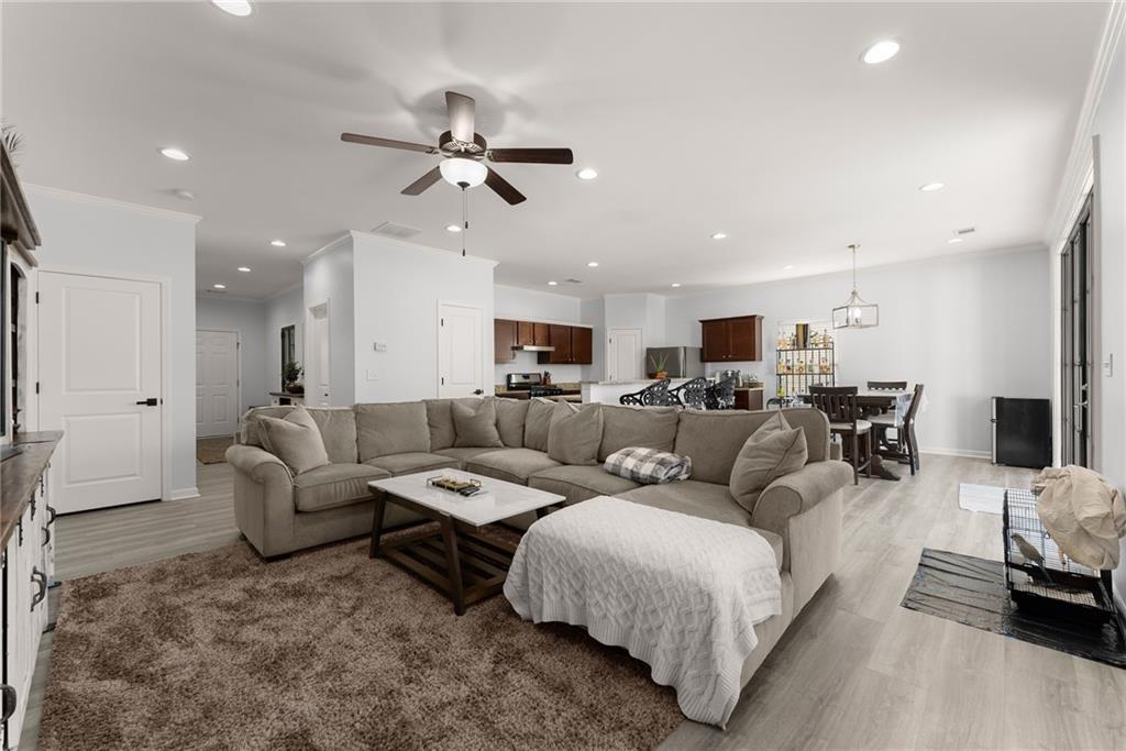 4302 Box Elder Path Gainesville, GA 30504 - Photo 8 of 53 a living room with furniture and a view of kitchen