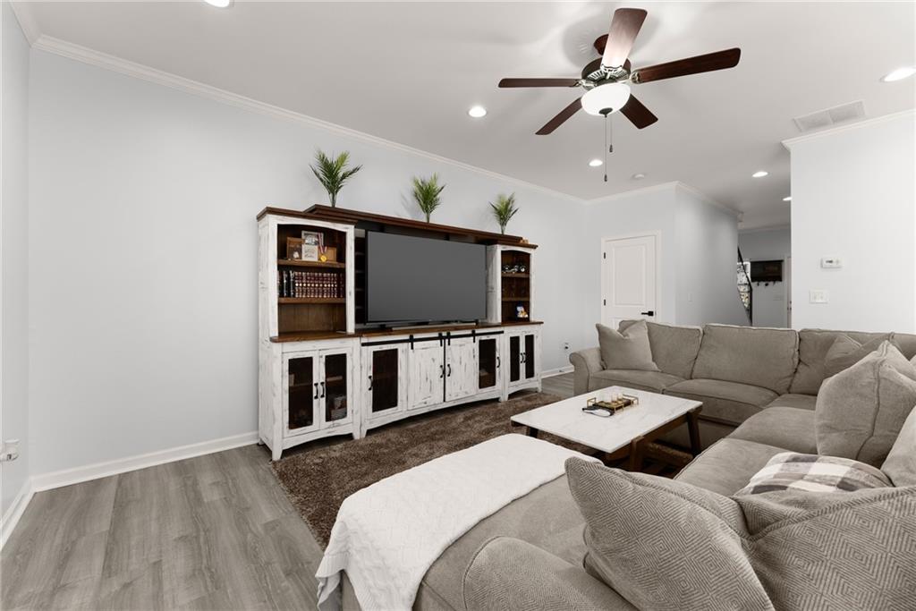 4302 Box Elder Path Gainesville, GA 30504 - Photo 9 of 53 a living room with furniture and a flat screen tv