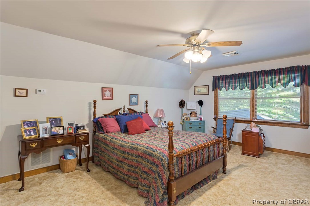 142 Sawmill Road White Stone, VA 22578 - Photo 34 of 38 Upstairs is ALL Primary Bedroom with wall of closet, door to walk-in attic space, & private bathroom