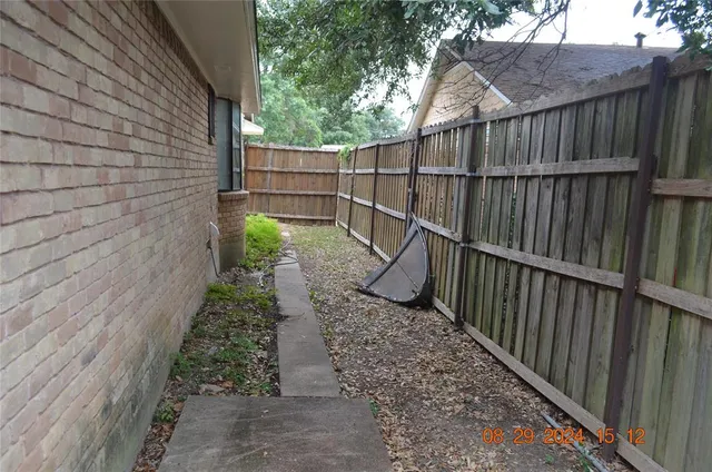 a view of a pathway with a backyard