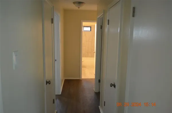 a view of a bathroom from a hallway