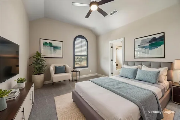 a bedroom with a balcony a bed and a couch