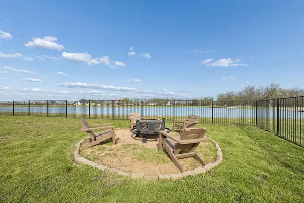 a view of a swimming pool and lounge chairs