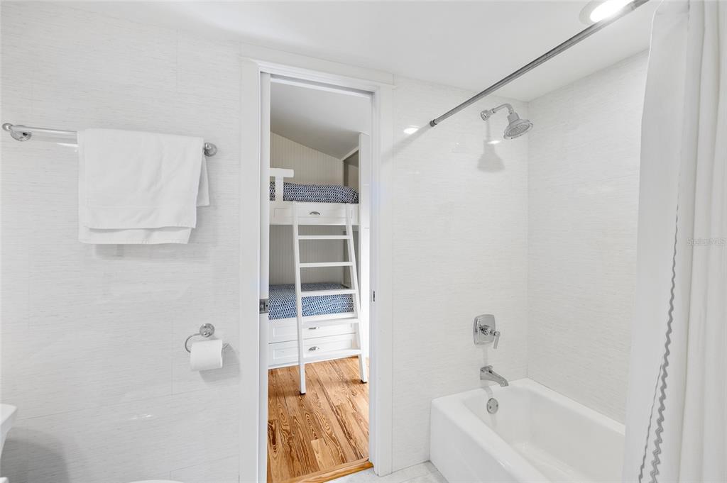 340 Palm Avenue Boca Grande, FL 33921 - Photo 17 of 38 a bathroom with a bathtub and a shower
