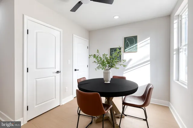 a dining room with furniture and window