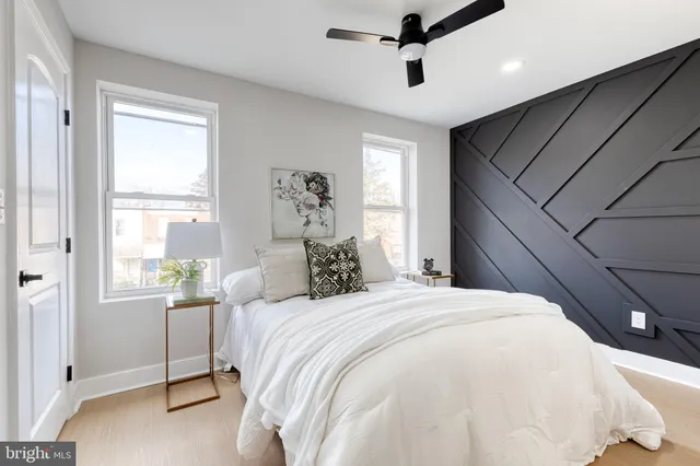 a bedroom with a large bed and a window