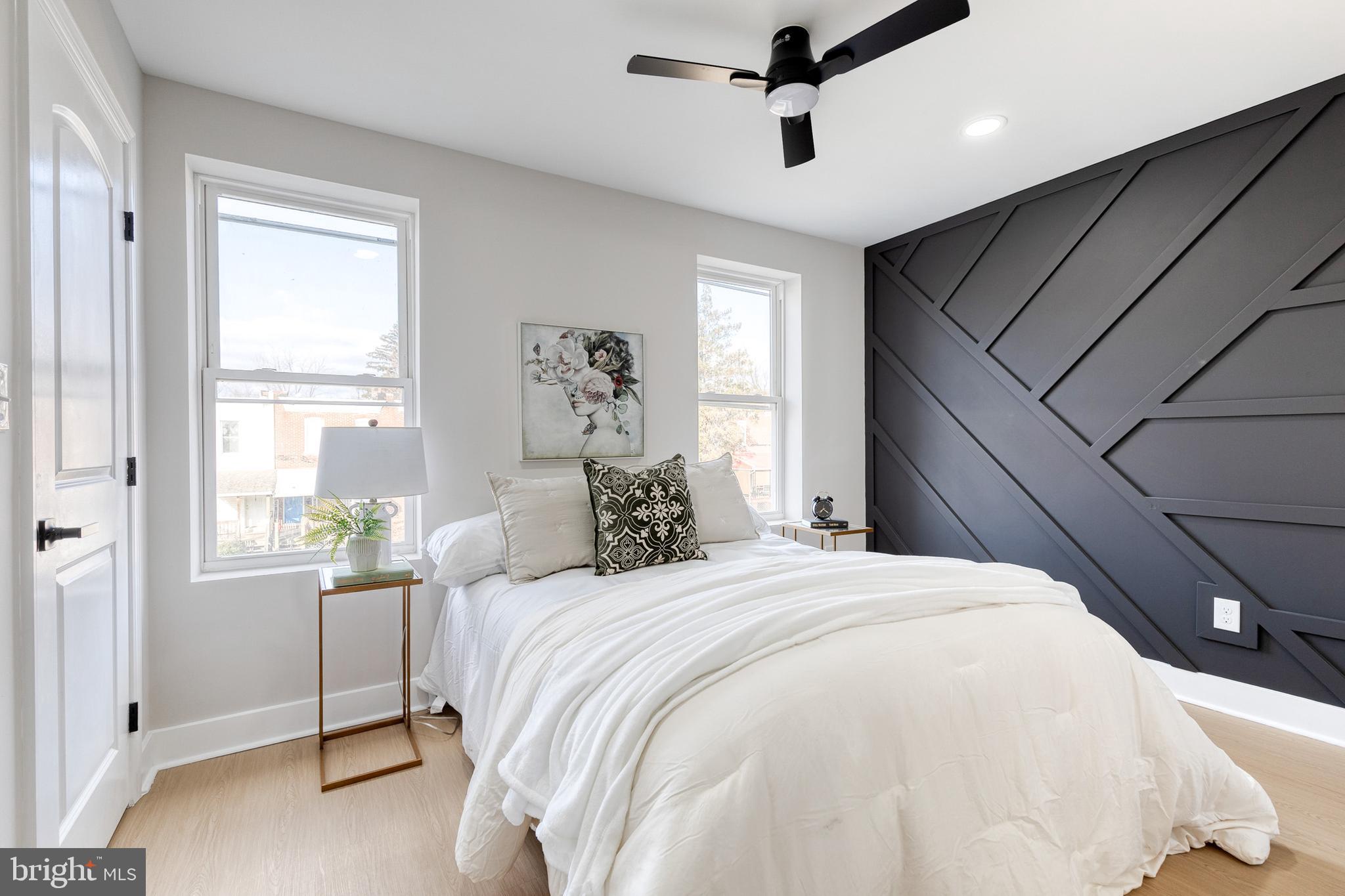 3721 Manchester Avenue Baltimore, MD 21215 - Photo 22 of 36 a bedroom with a large bed and a window