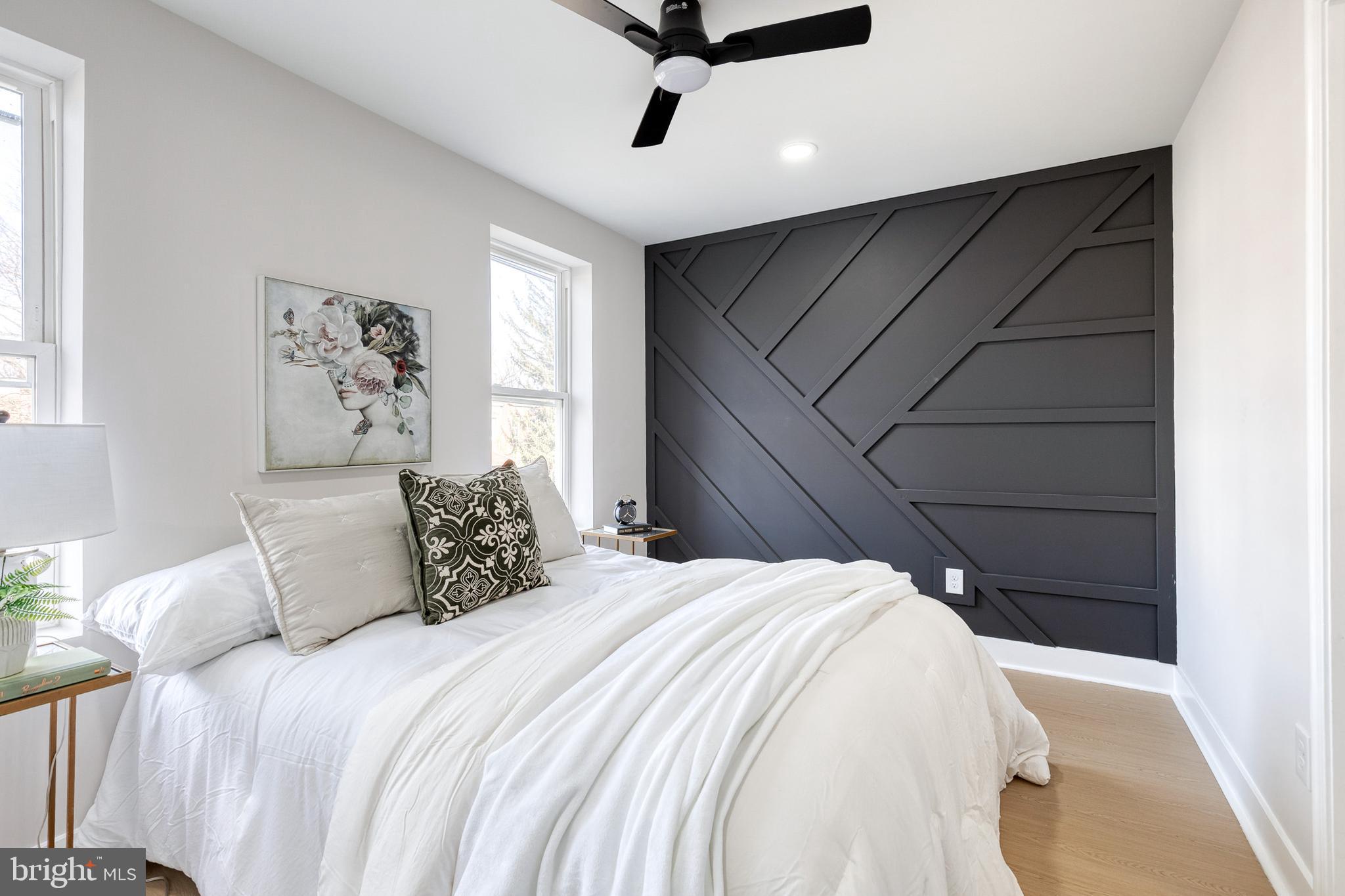 3721 Manchester Avenue Baltimore, MD 21215 - Photo 23 of 36 a bedroom with a bed and window