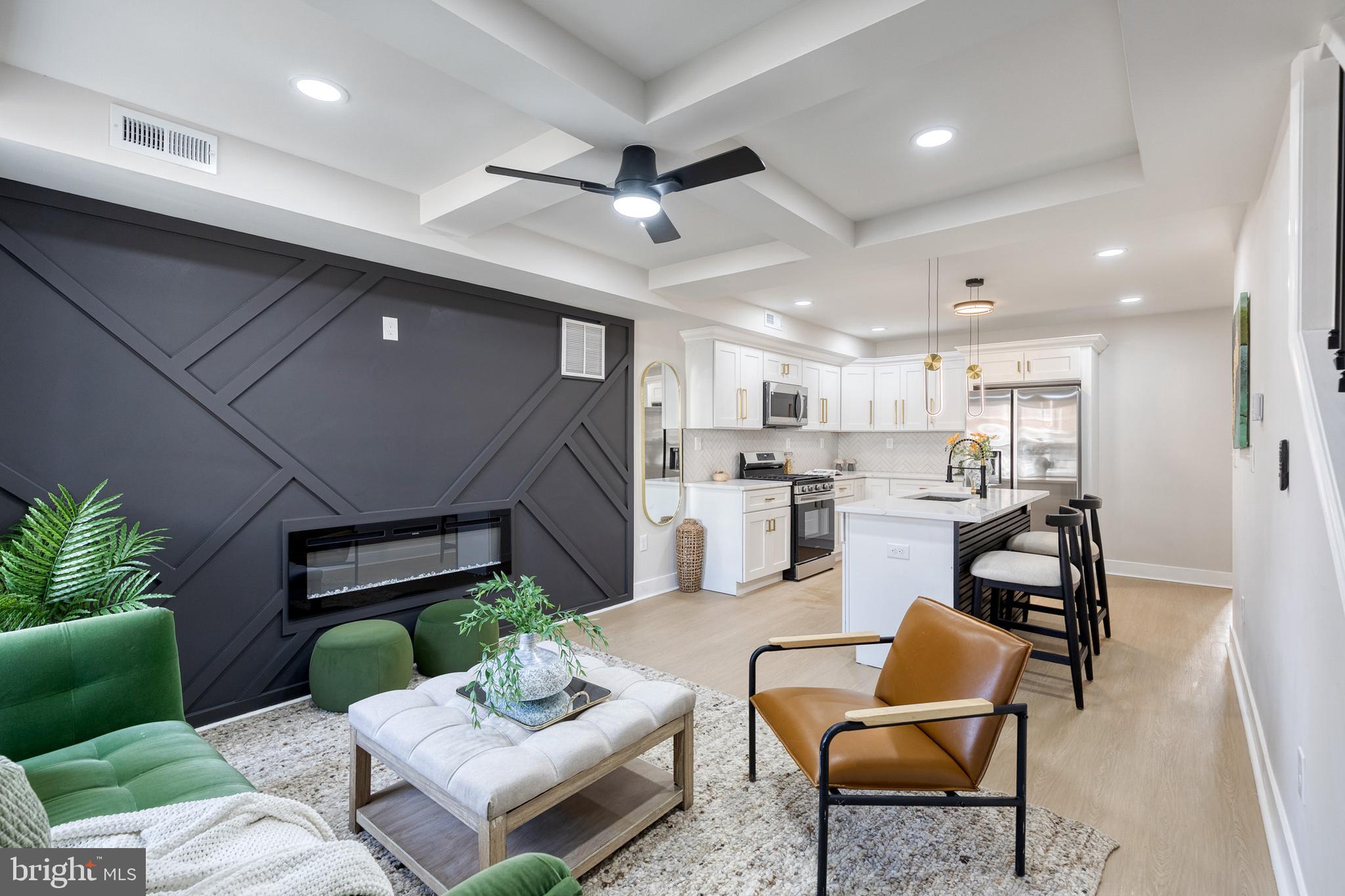 3721 Manchester Avenue Baltimore, MD 21215 - Photo 5 of 36 a living room with furniture kitchen view and a potted plant