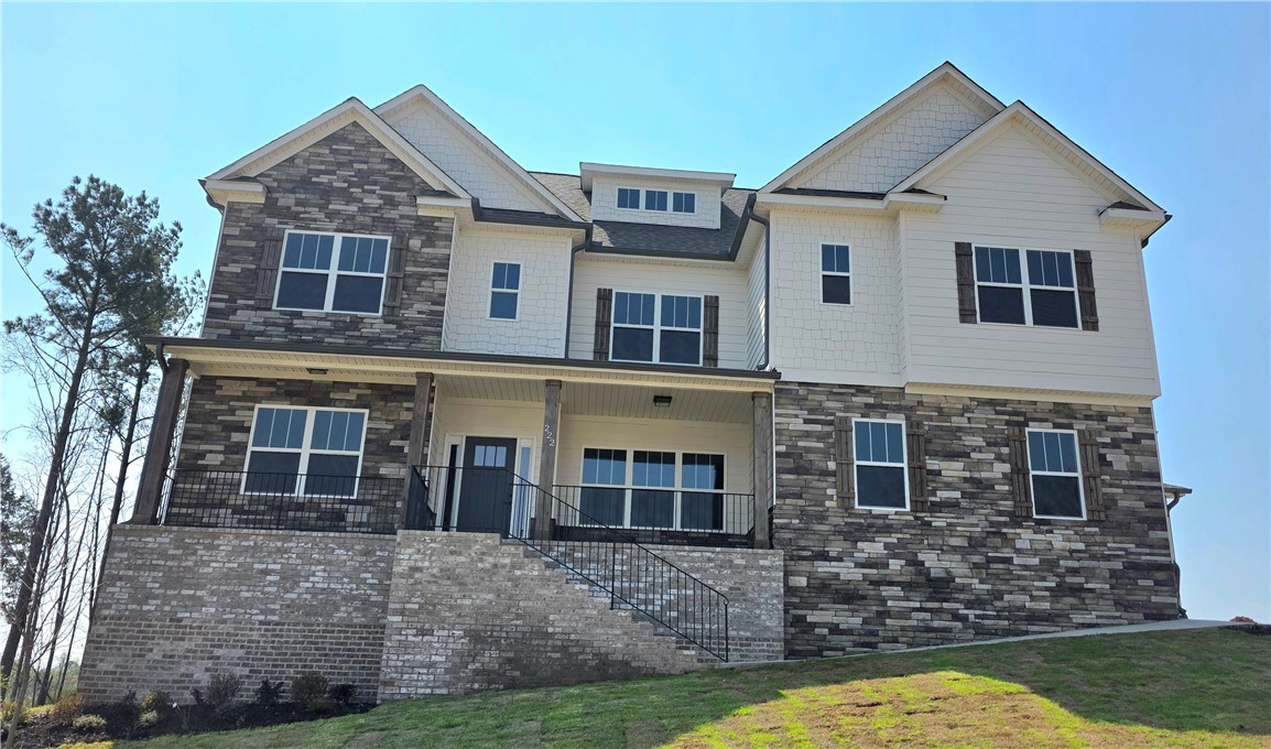 222 Holly Br Road Piedmont, SC 29673 - Photo 1 of 31 This newly constructed residence showcases a charming facade with a blend of natural stone and classic siding.
