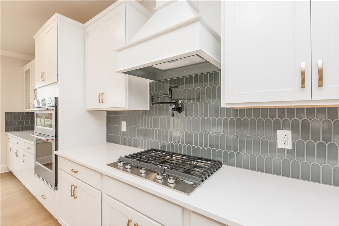 222 Holly Br Road Piedmont, SC 29673 - Photo 13 of 31 This bright kitchen features sleek appliances and ample counter space for culinary pursuits.