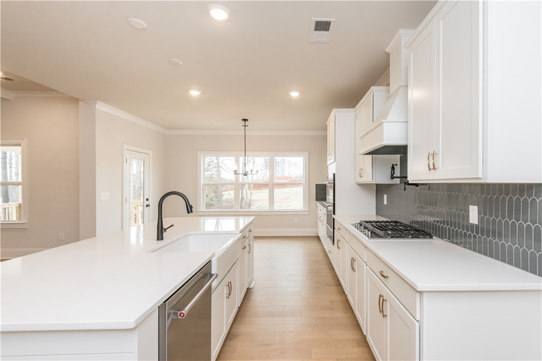 222 Holly Br Road Piedmont, SC 29673 - Photo 14 of 31 Bright and inviting kitchen with ample counter space, perfect for culinary endeavors.