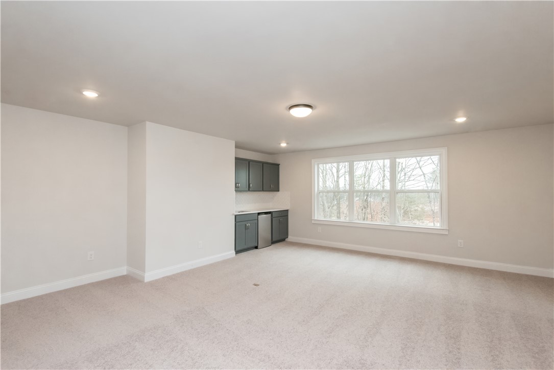 222 Holly Br Road Piedmont, SC 29673 - Photo 28 of 31 This versatile room features a wet bar and ample space, ideal for entertaining or quiet enjoyment.
