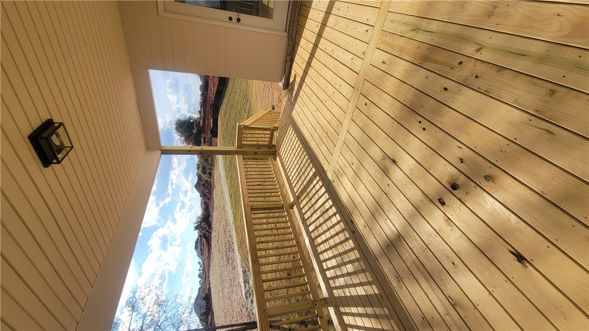 222 Holly Br Road Piedmont, SC 29673 - Photo 30 of 31 This spacious wooden deck offers an inviting outdoor retreat for relaxation and entertainment.