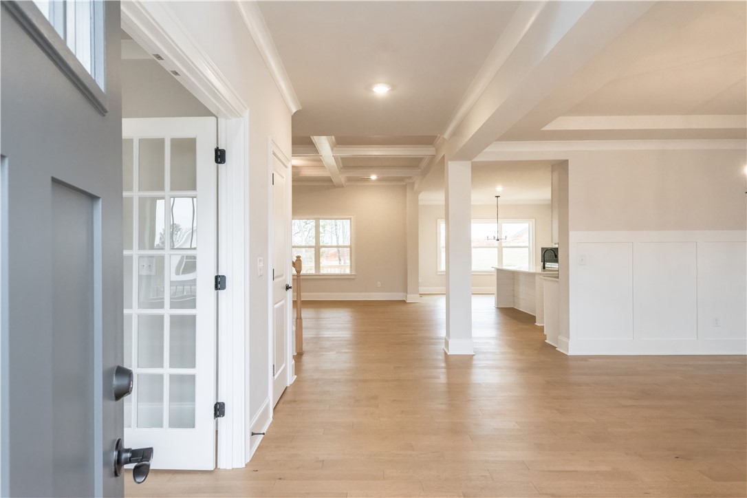 222 Holly Br Road Piedmont, SC 29673 - Photo 4 of 31 Step into this luminous space featuring expansive hardwood floors and elegant crown molding throughout.
