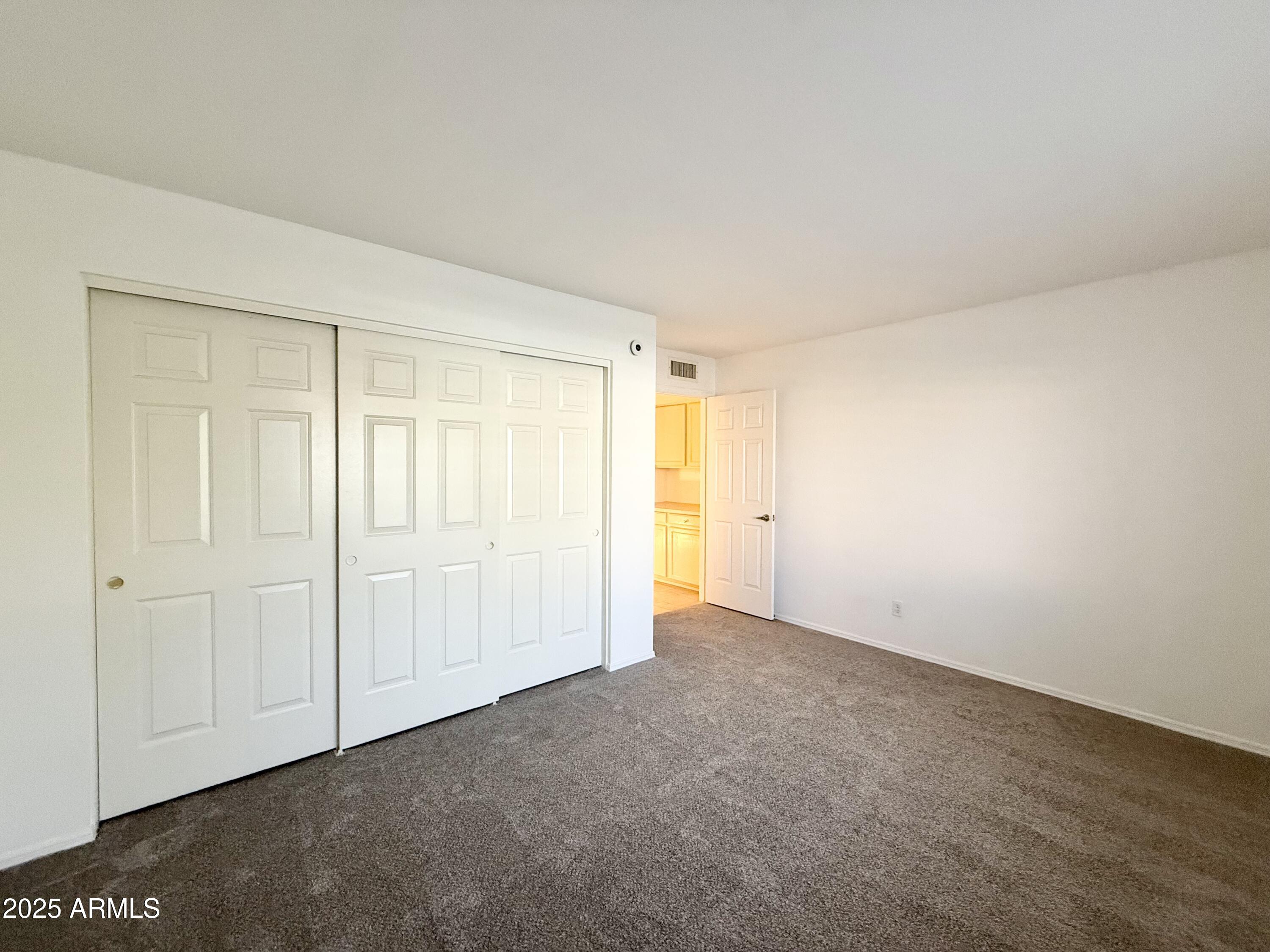 7641 East Pueblo Avenue Mesa, AZ 85208 - Photo 12 of 20 an empty room with a natural light