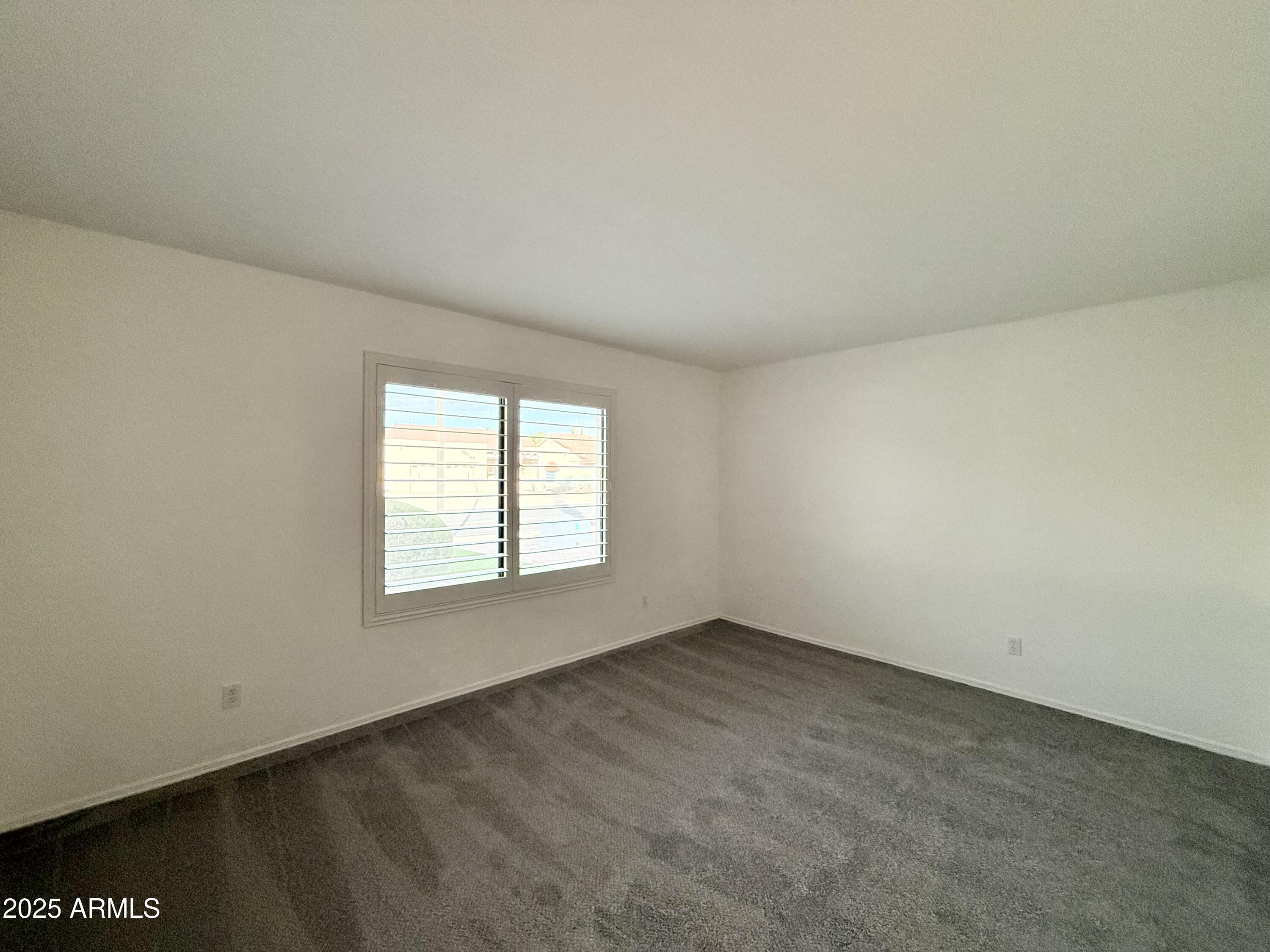7641 East Pueblo Avenue Mesa, AZ 85208 - Photo 13 of 20 an empty room with a window