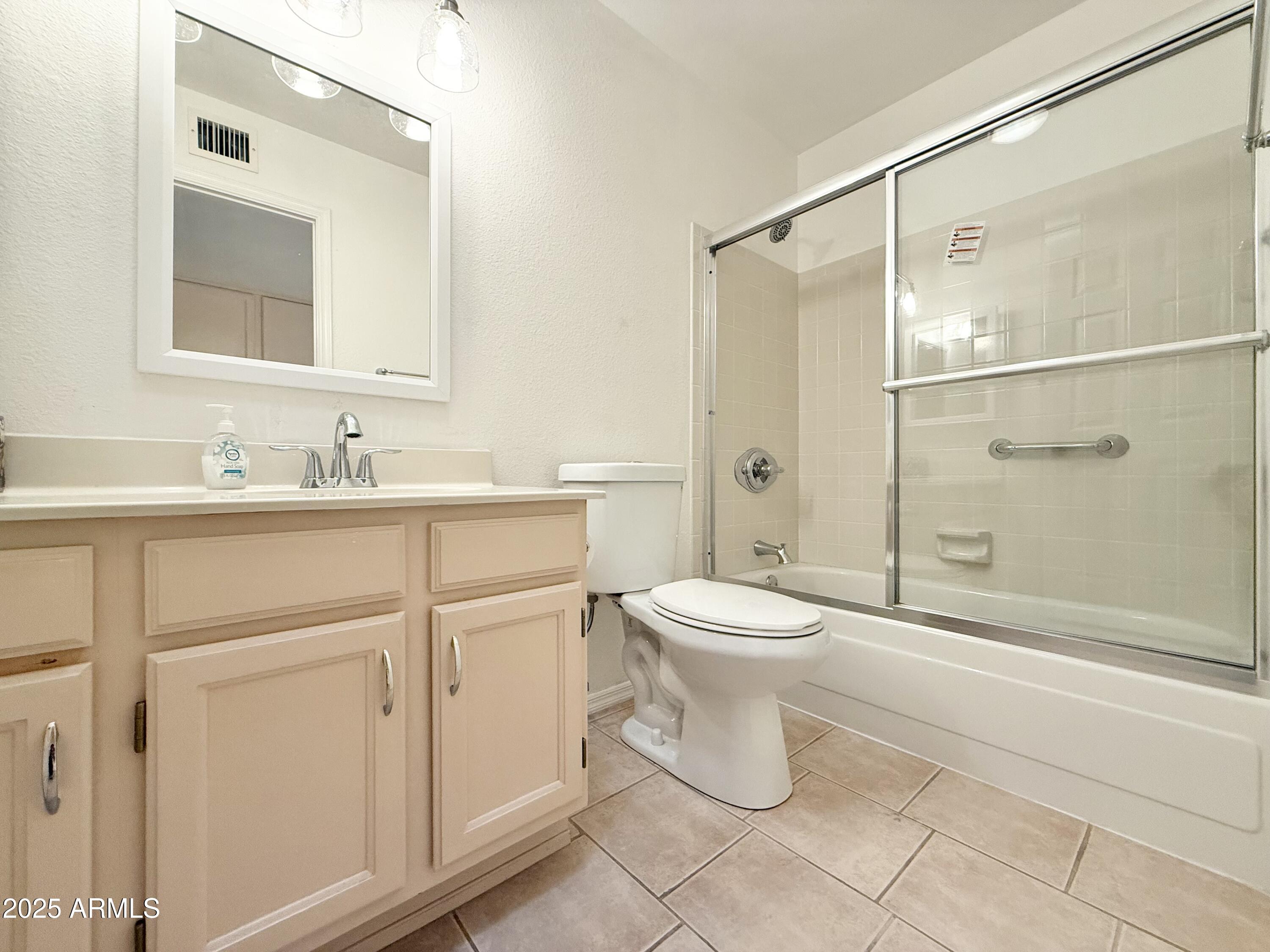 7641 East Pueblo Avenue Mesa, AZ 85208 - Photo 14 of 20 a bathroom with a toilet sink and shower
