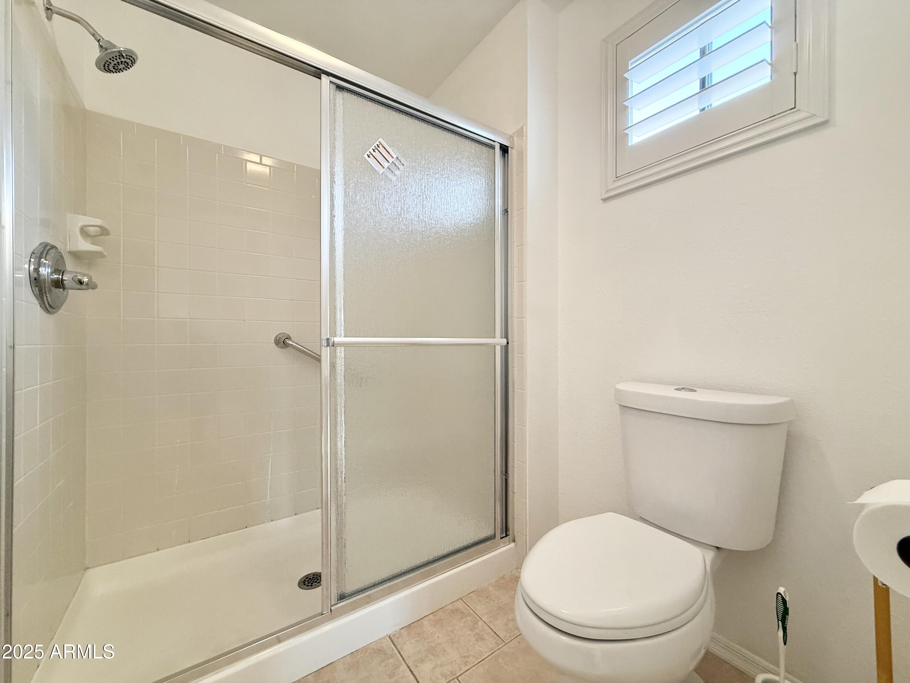 7641 East Pueblo Avenue Mesa, AZ 85208 - Photo 16 of 20 a bathroom with a toilet and a shower