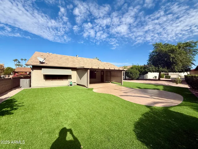 a view of a house with a back yard