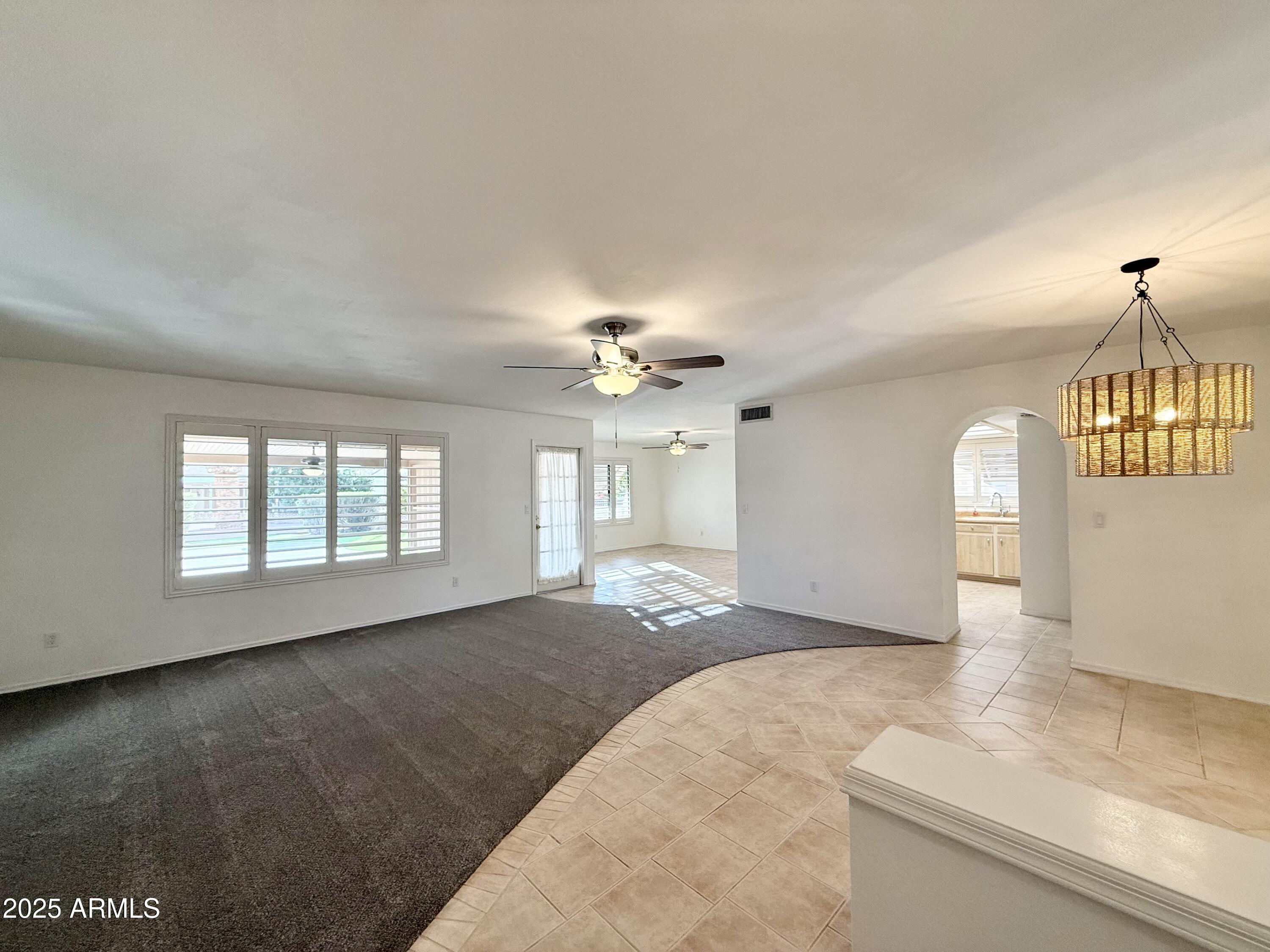 7641 East Pueblo Avenue Mesa, AZ 85208 - Photo 4 of 20 a view of an empty room with a window