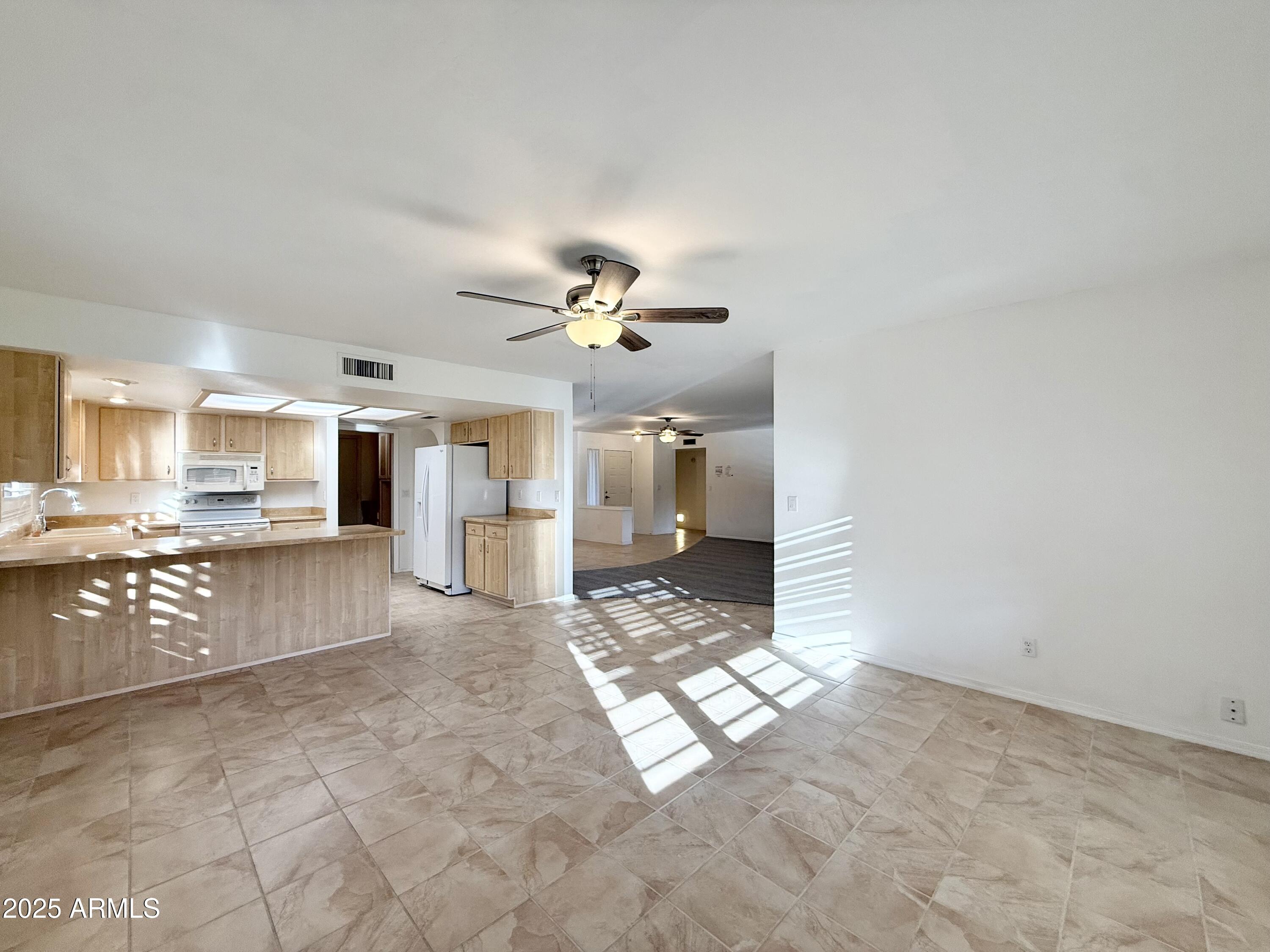 7641 East Pueblo Avenue Mesa, AZ 85208 - Photo 6 of 20 a view of a kitchen with a sink and a window