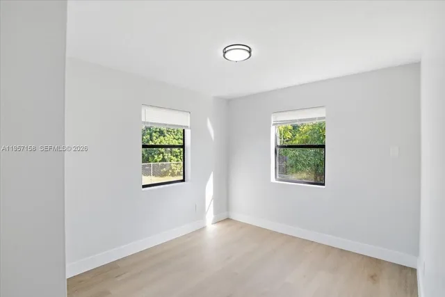 a view of yard along with trees