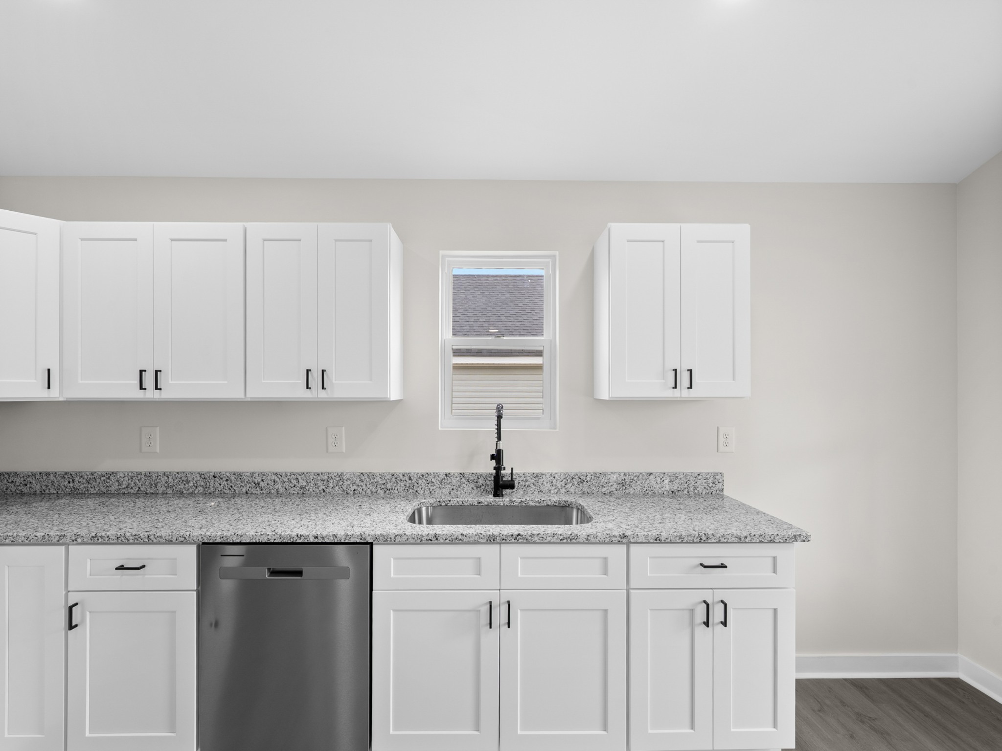 711 Hunt Street Winchester, TN 37398 - Photo 13 of 30 a kitchen with granite countertop white cabinets and a sink