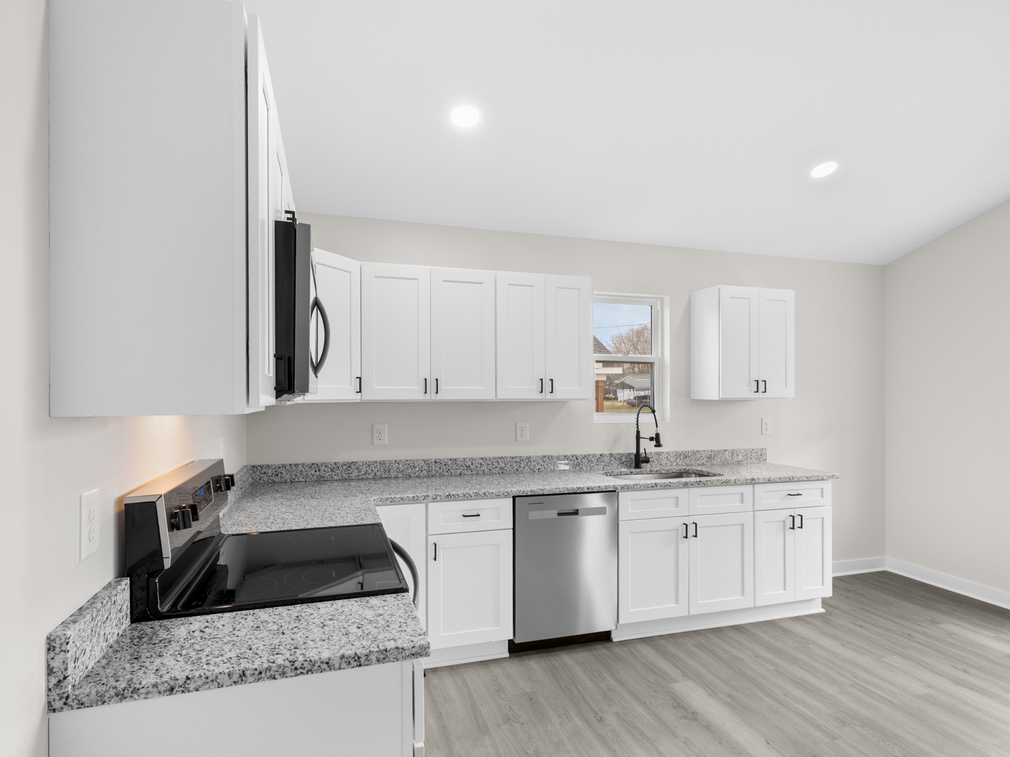 711 Hunt Street Winchester, TN 37398 - Photo 14 of 30 a kitchen with a sink stove and cabinets