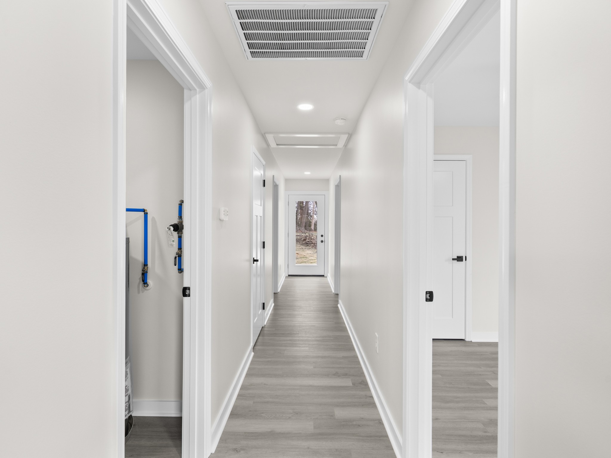 711 Hunt Street Winchester, TN 37398 - Photo 16 of 30 a view of a hallway with wooden floor and staircase