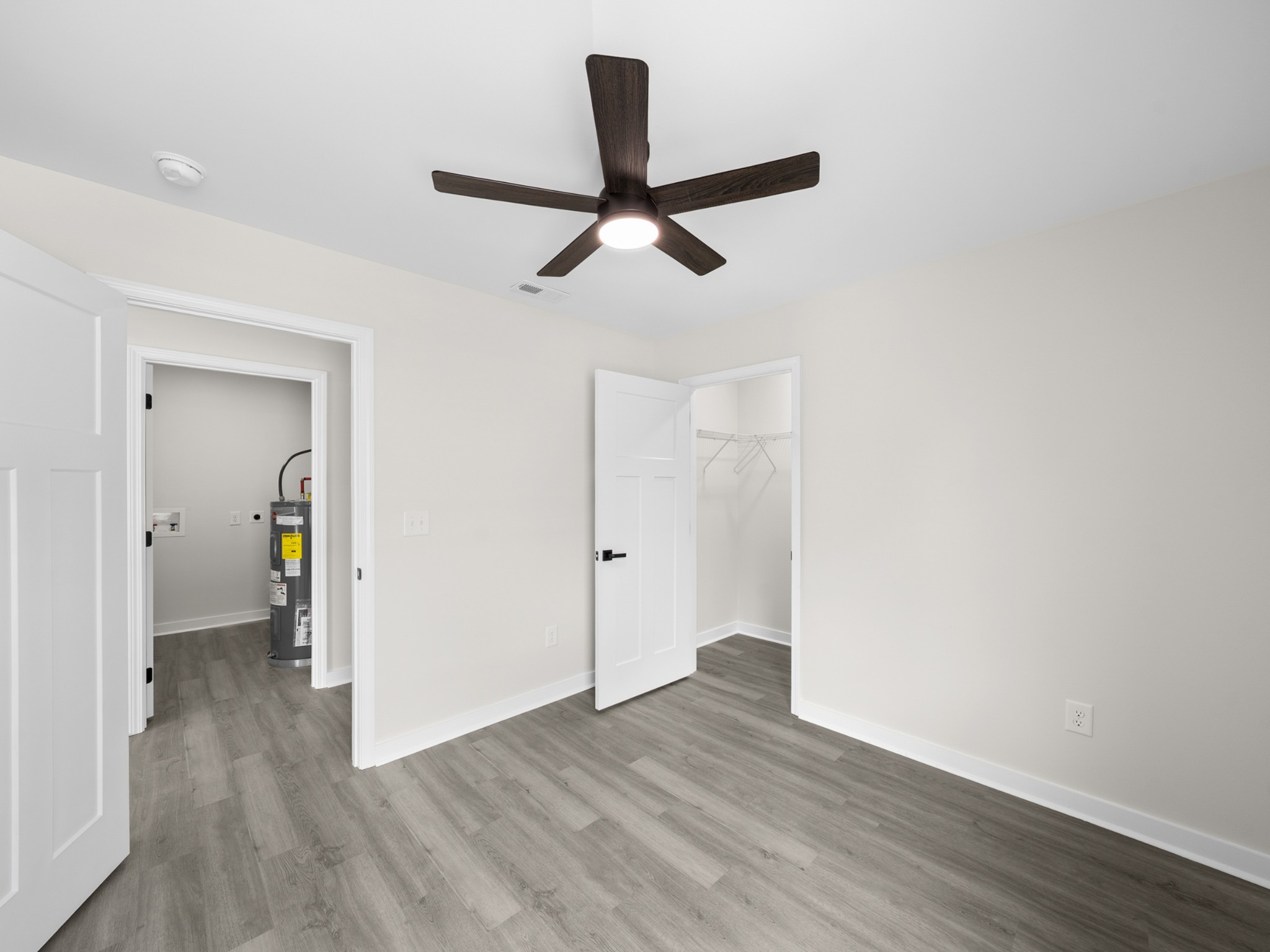 711 Hunt Street Winchester, TN 37398 - Photo 18 of 30 a view of a room with wooden floor and a ceiling fan