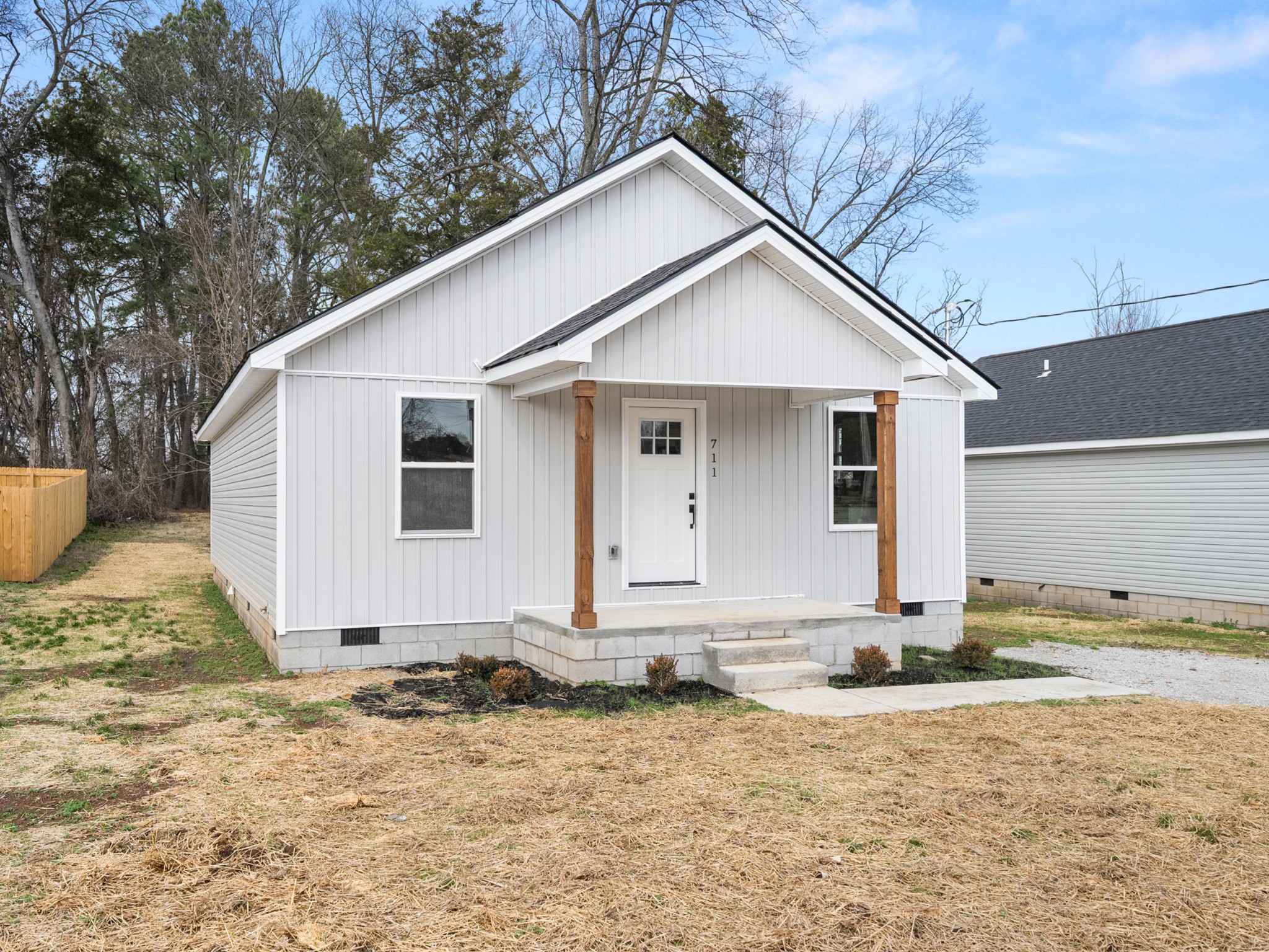 711 Hunt Street Winchester, TN 37398 - Photo 2 of 30 a view of a small house with yard