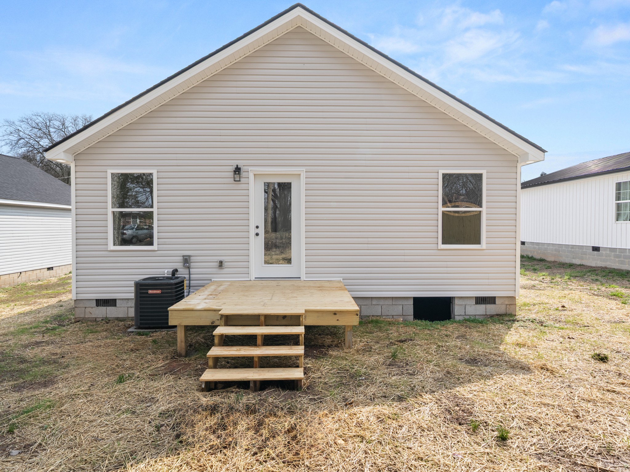 711 Hunt Street Winchester, TN 37398 - Photo 28 of 30 a backyard of a house with barbeque oven table and chairs