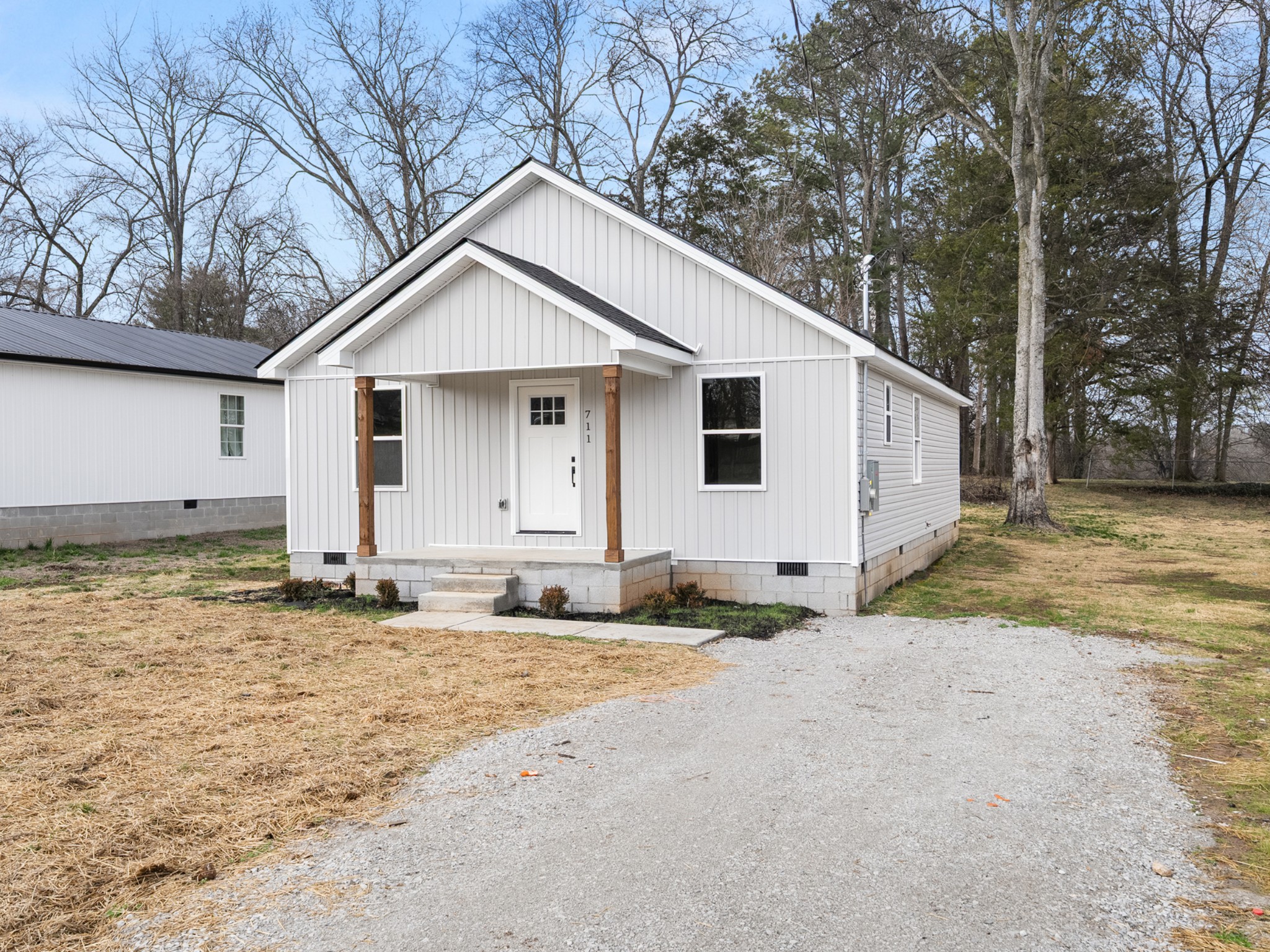711 Hunt Street Winchester, TN 37398 - Photo 3 of 30 a view of a house with a yard covered with snow