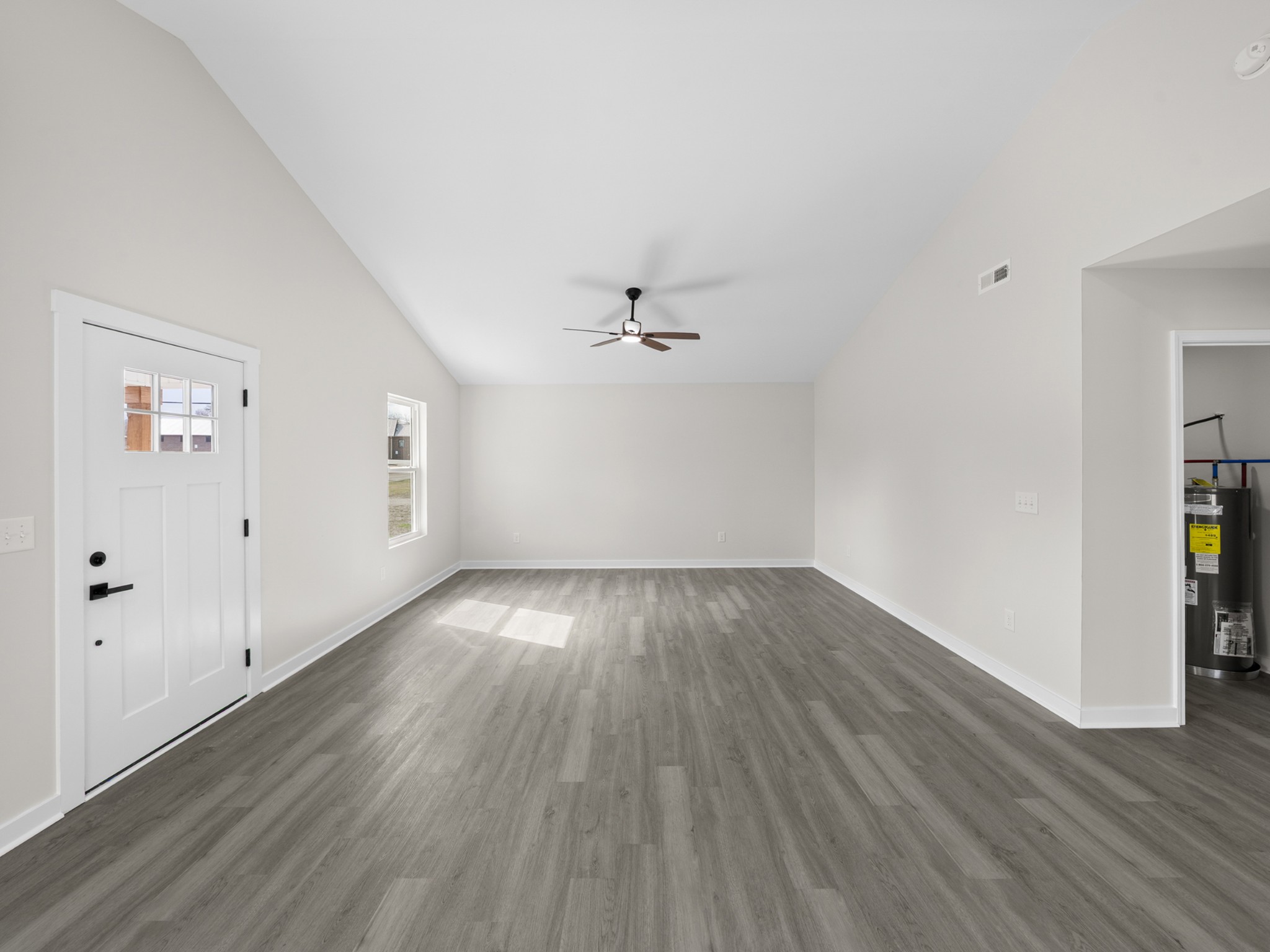 711 Hunt Street Winchester, TN 37398 - Photo 7 of 30 wooden floor in an empty room with a window