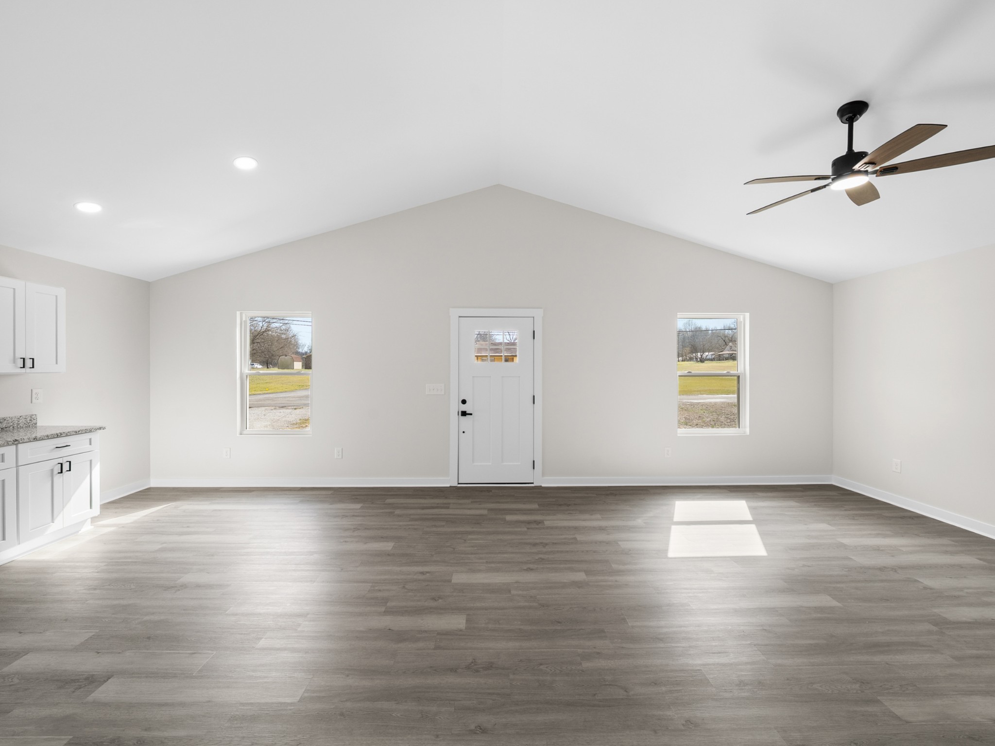 711 Hunt Street Winchester, TN 37398 - Photo 8 of 30 an empty room with wooden floor and windows